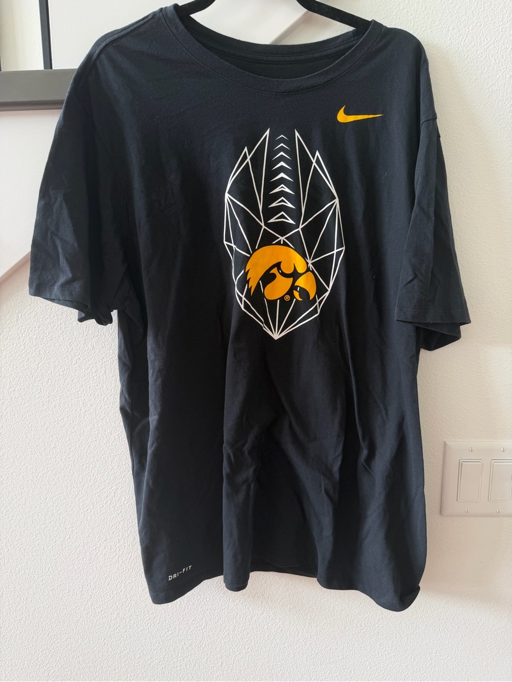 Nike Iowa Hawkeyes Black Short-Sleeve Tee with Yellow Graphic and Swoosh